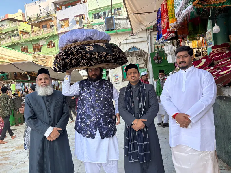 A group gathered in a busy market street